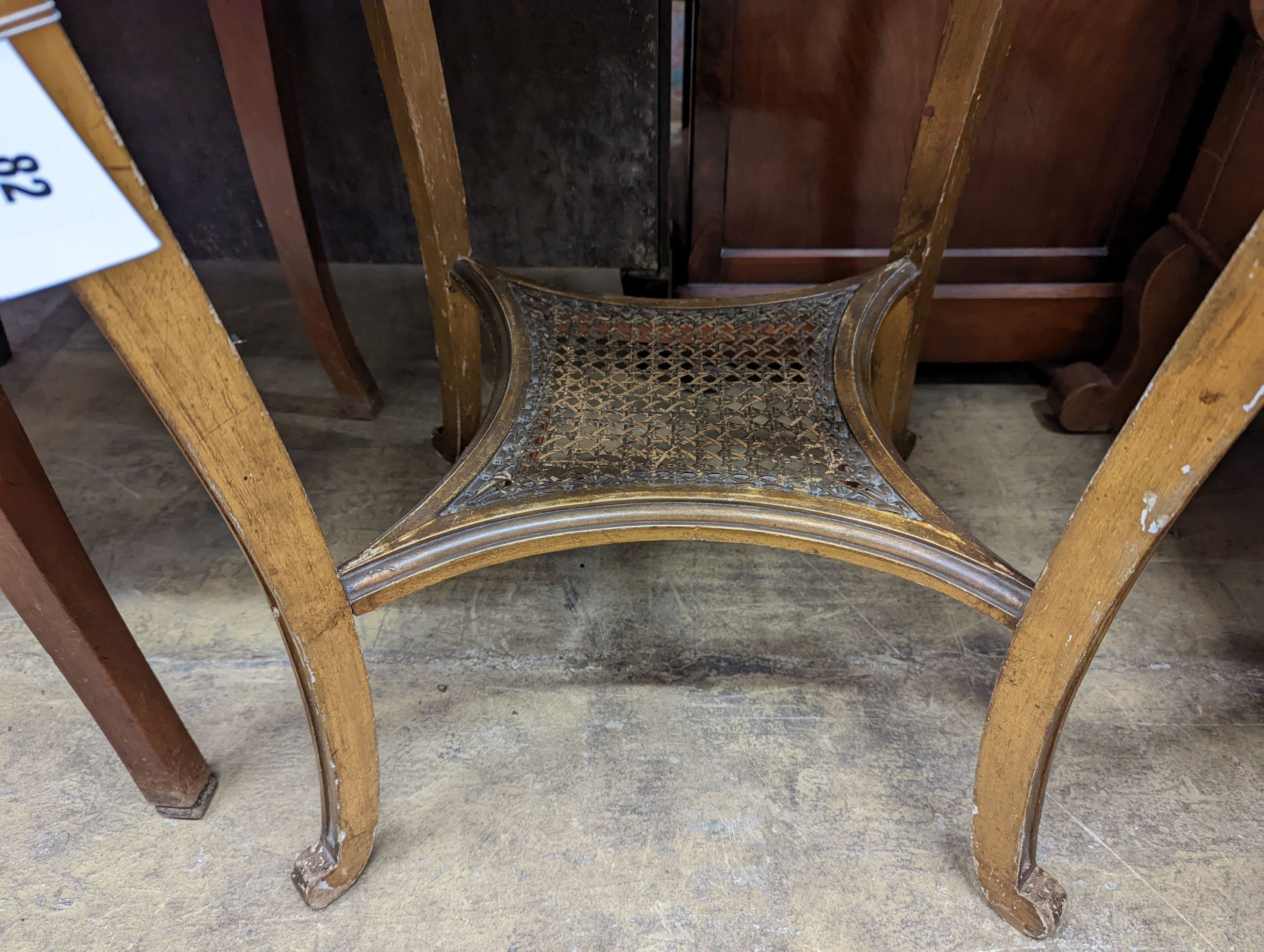 A French caned giltwood circular centre table with reconstituted marble top, diameter 55cm, height 76cm